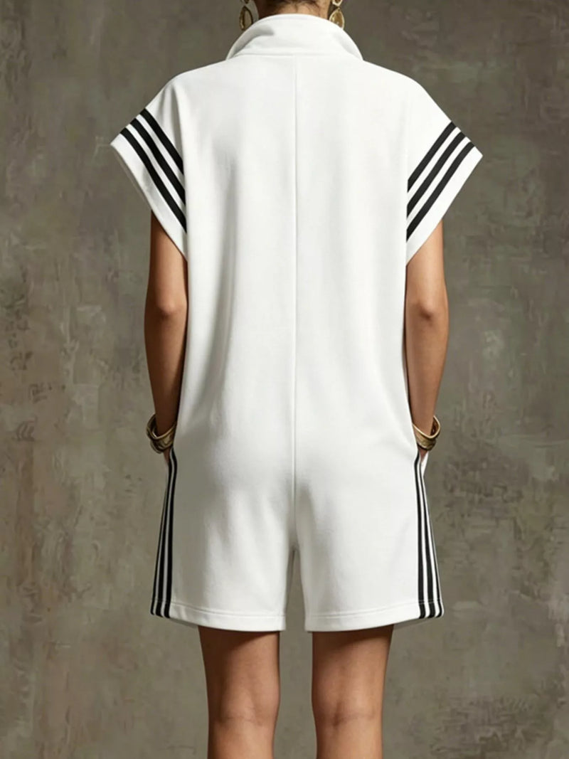 White sleeveless dress with black stripes on a textured gray background