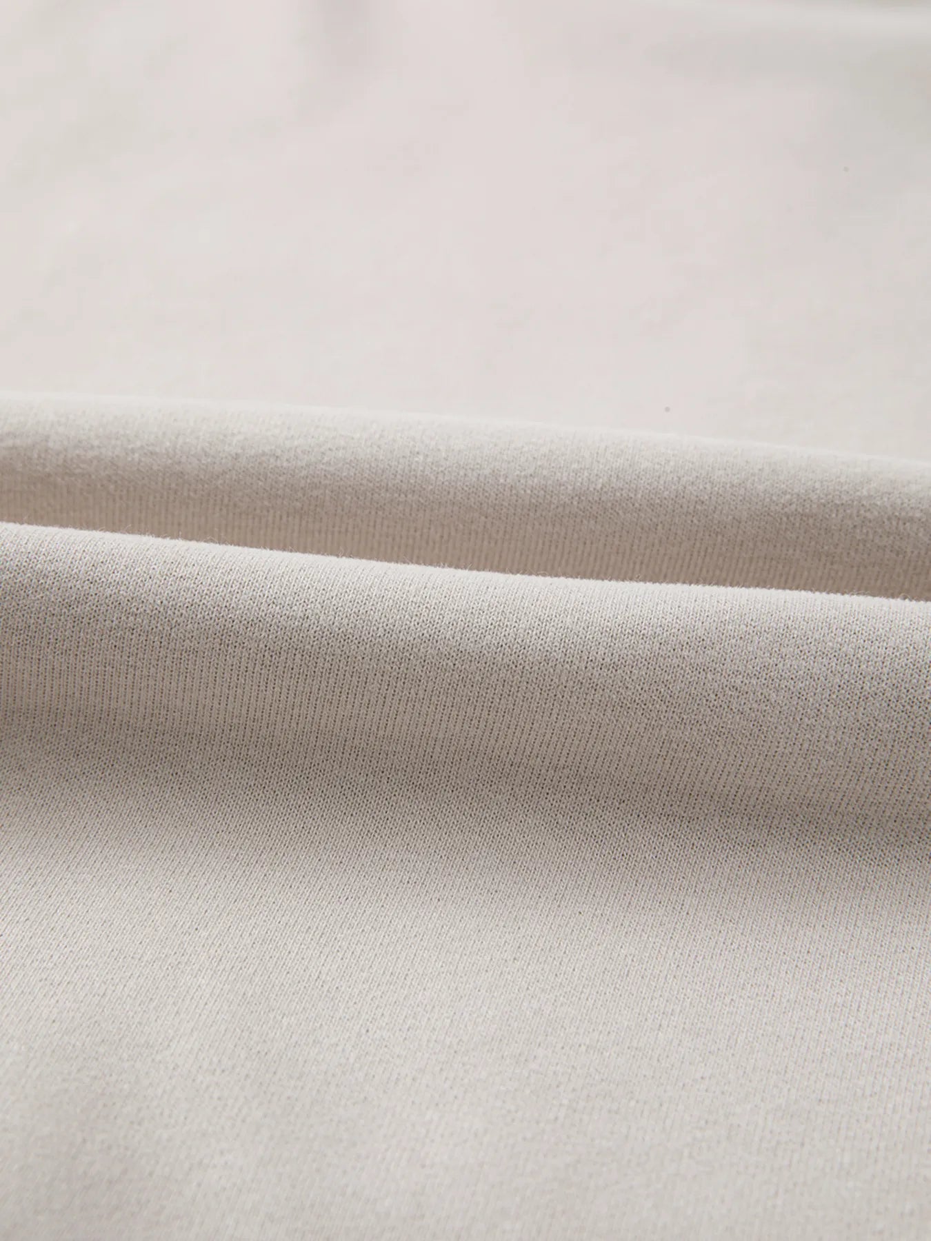 Close-up of beige fabric with a subtle texture