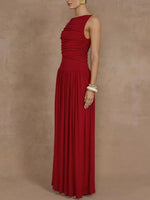 Red evening gown on a model against a beige background