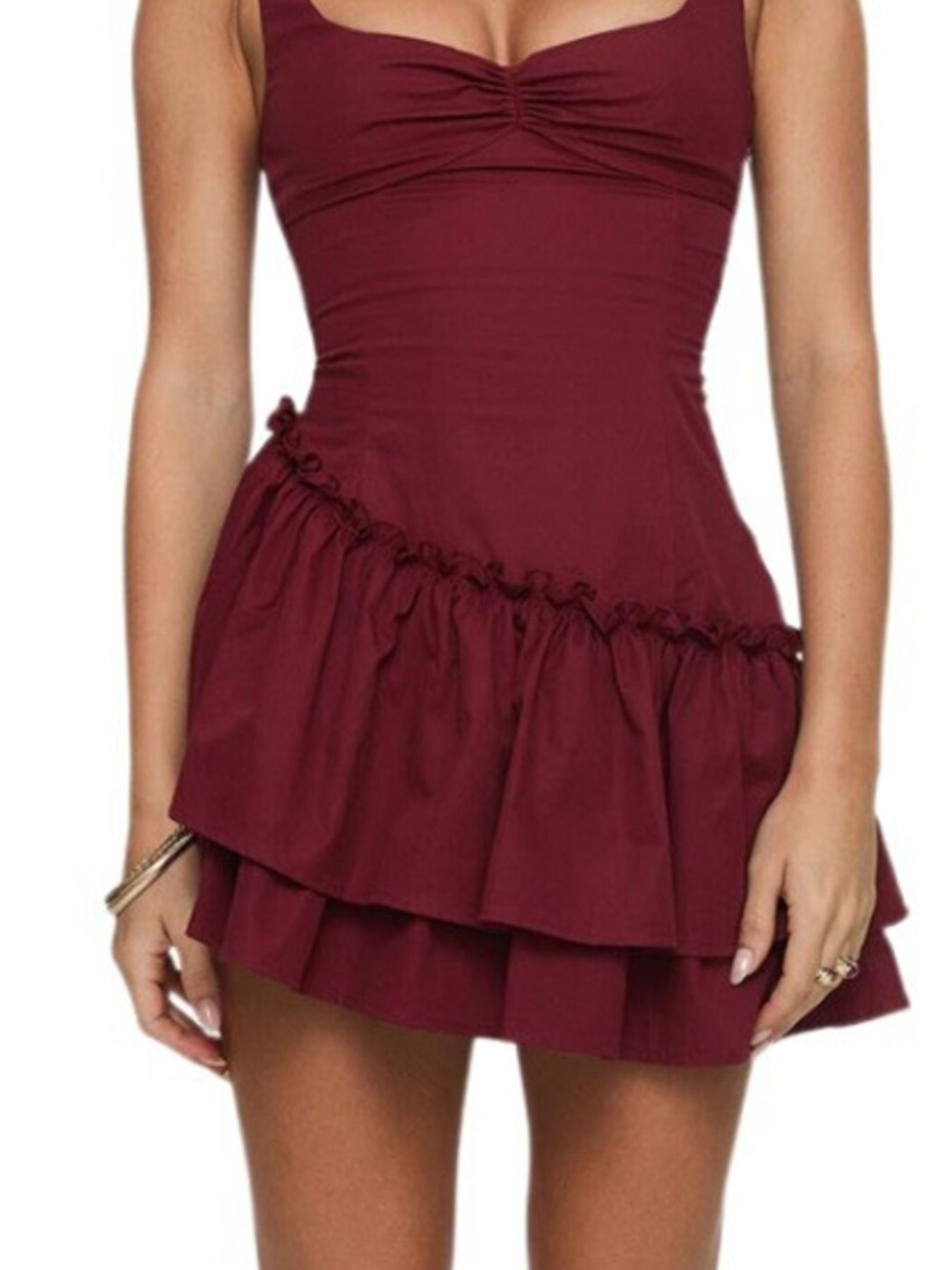 Maroon dress with ruffled skirt on a white background