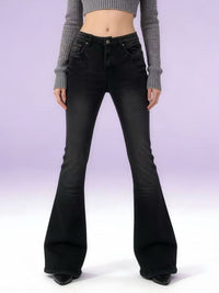 Black flared jeans worn by a person on a white background