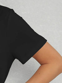 Black t-shirt sleeve on a gray background