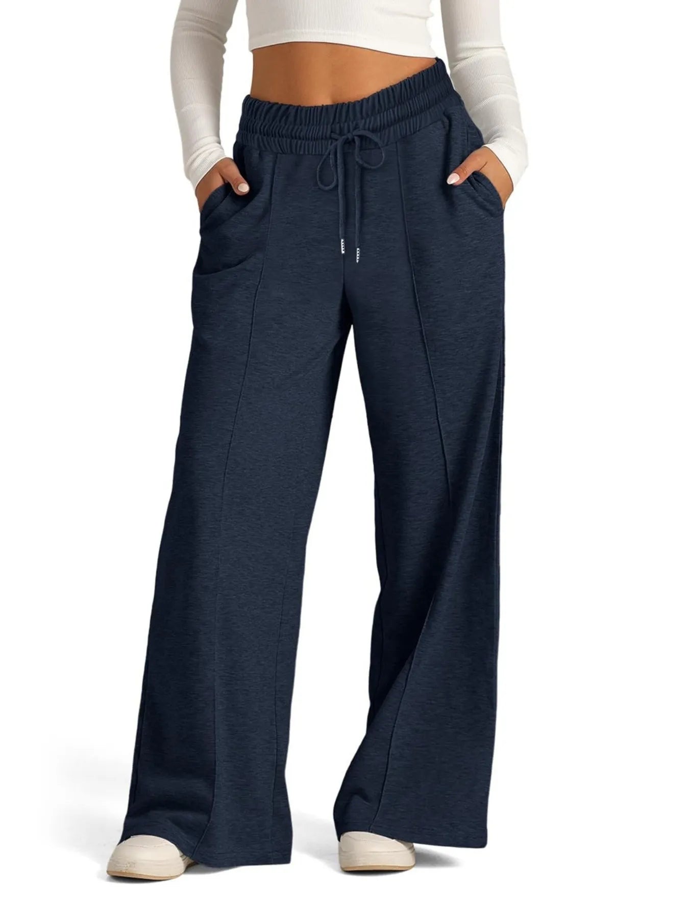 Navy blue wide-leg pants worn by a person on a white background