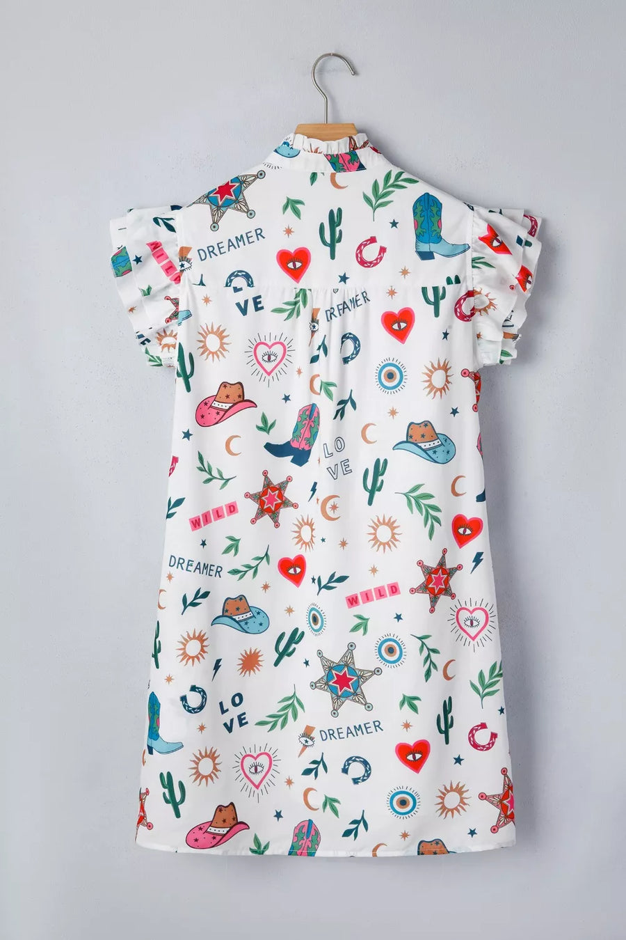 Children's dress with colorful patterns on a gray background