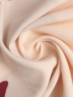 Close-up of beige fabric with a subtle pattern