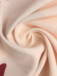 Close-up of beige fabric with a subtle pattern