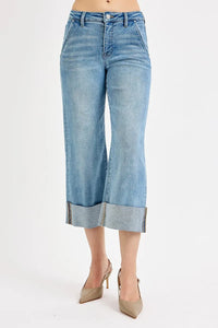 Light blue denim culottes worn by a person on a white background