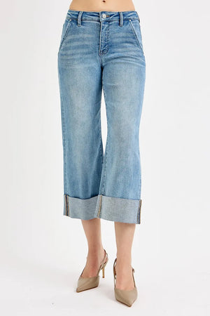 Light blue denim culottes worn by a person on a white background