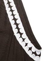 Brown fabric with white lace trim on a white background