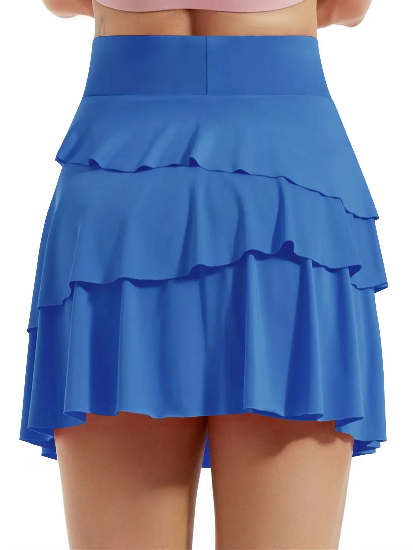 Blue ruffled skirt worn by a person on a white background