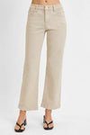 Beige wide-leg jeans worn by a person on a white background