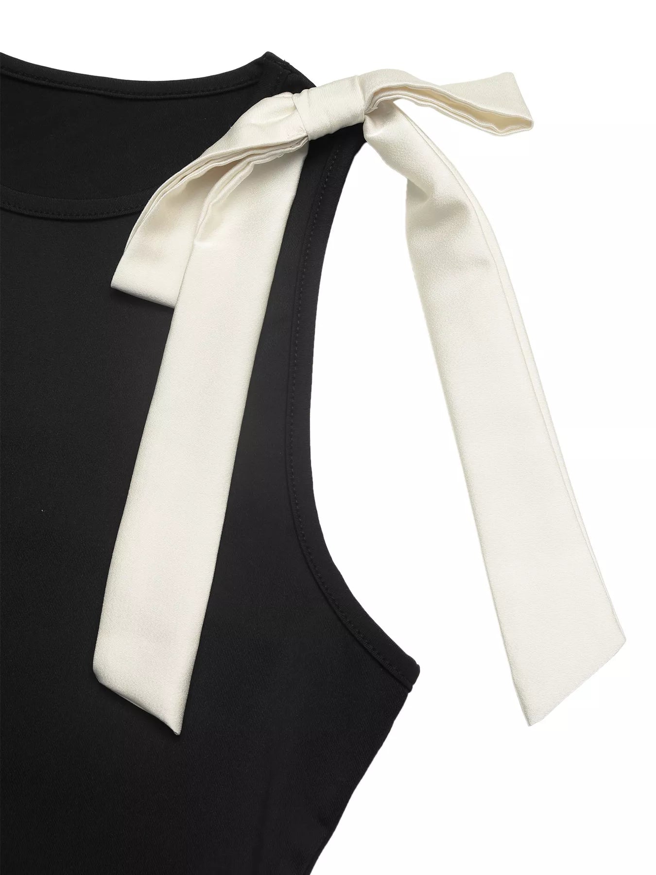 Black sleeveless top with a white ribbon on a white background