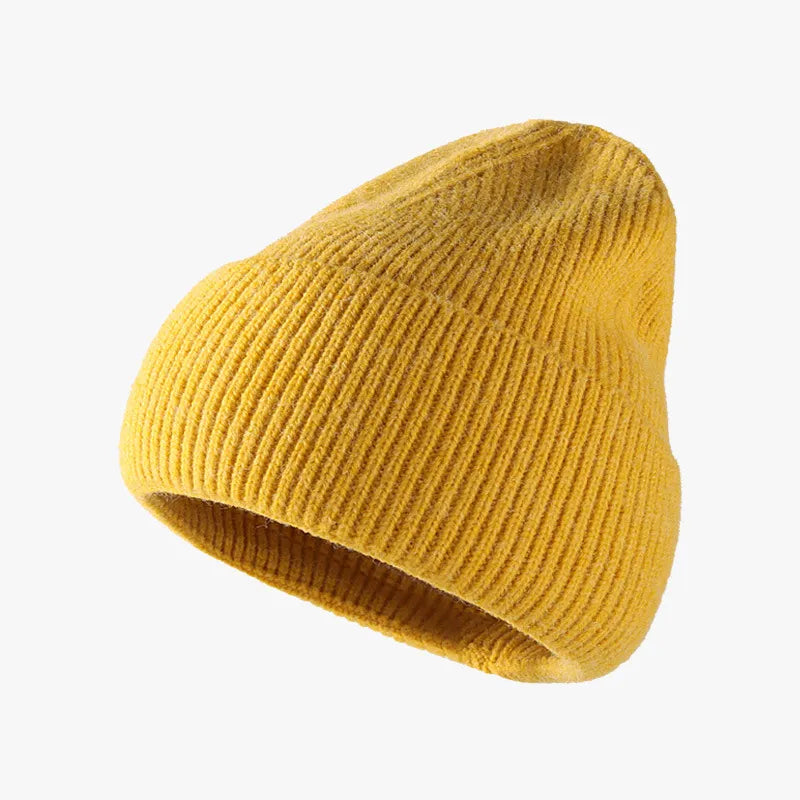 Yellow knit beanie on a white background