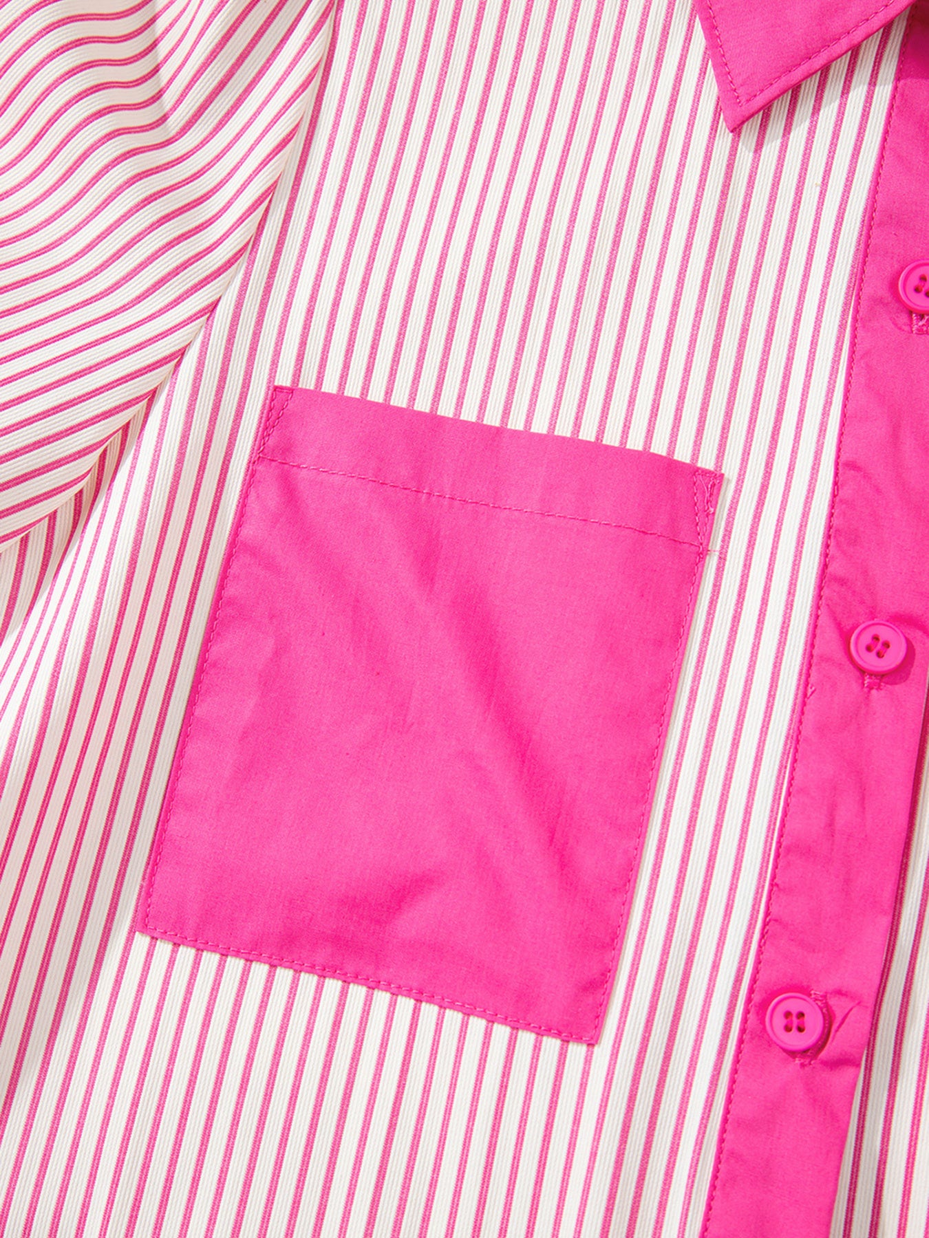 Close-up of a pink and white striped shirt with a pink pocket.