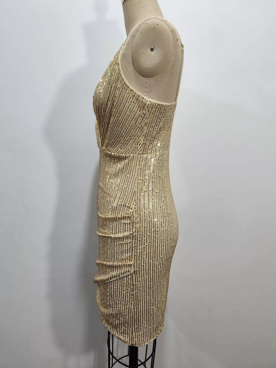 A sleeveless, bodycon mini dress covered in vertical gold sequins, displayed on a beige mannequin against a plain white wall.