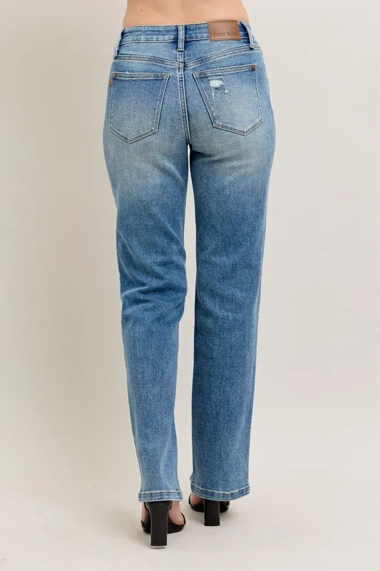 Blue jeans on a plain background