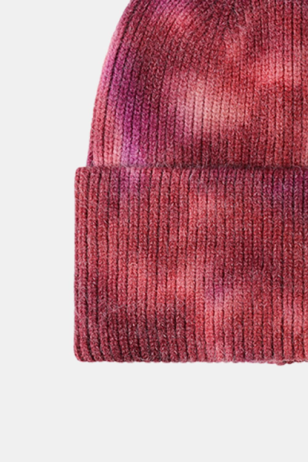 Close-up of a red knit beanie on a white background