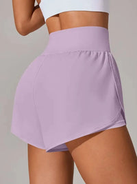 Person wearing a light purple skirt on a plain background