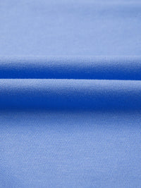 Close-up of blue fabric with a subtle pattern