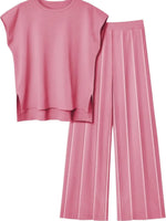 Pink sleeveless top and wide-leg pants set on a white background