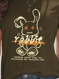 Brown t-shirt with a graphic of a rabbit and text on a person wearing it.