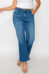 Person wearing blue jeans on a white background