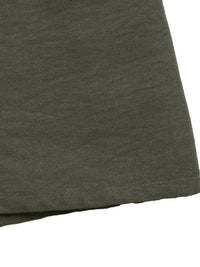 Close-up of a dark green fabric texture on a white background