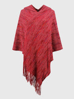 Red poncho with fringe on a white background