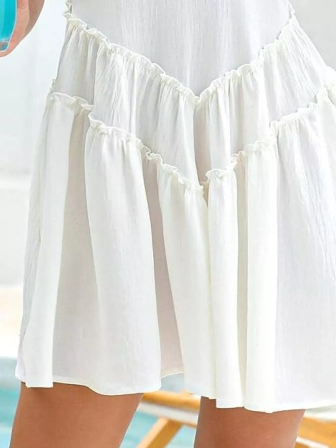 White ruffled skirt with a blurred background