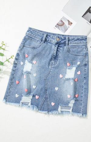 Front view of Distressed Raw Hem Heart Denim Skirt