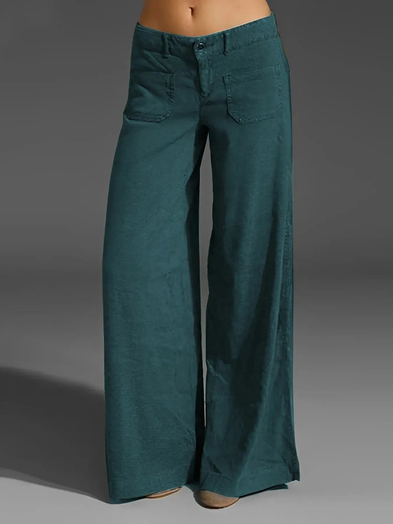 Teal wide-leg pants on a gray background