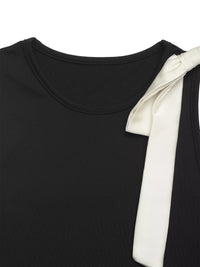 Black top with a white bow detail on a white background