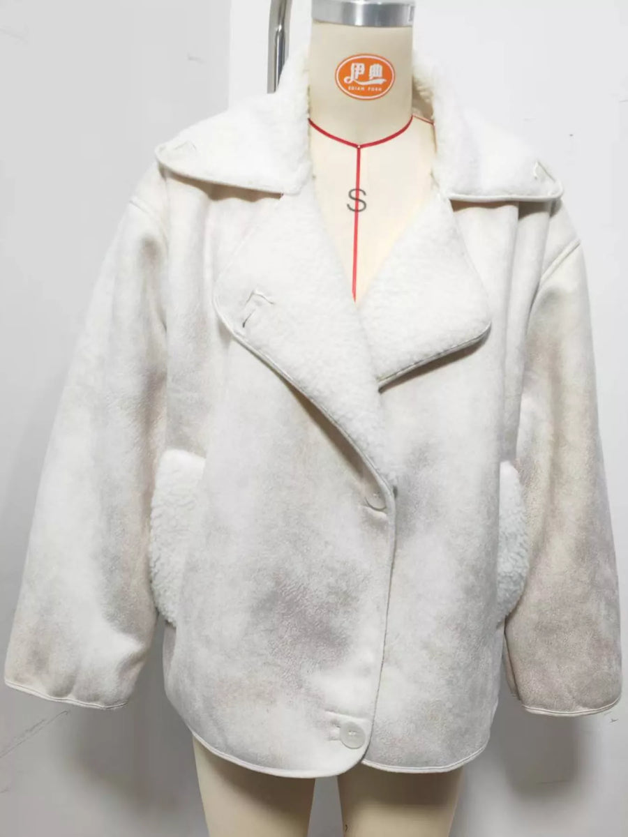 A white sherpa fleece jacket displayed on a beige mannequin torso against a plain white background.