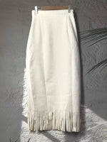white High-Waisted Fringe Midi Skirt on a gray backdrop