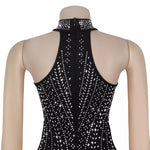 Black sleeveless top with sparkling white stones on a mannequin against a white background