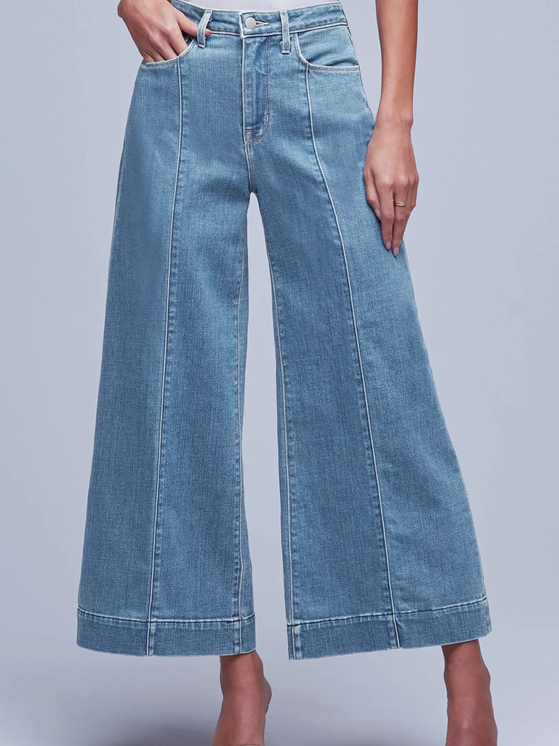 Wide-leg jeans on a plain background
