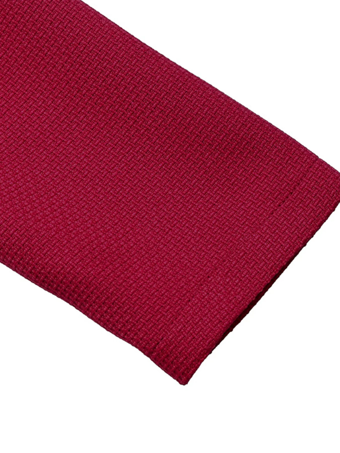 Close-up of a red knitted fabric on a white background