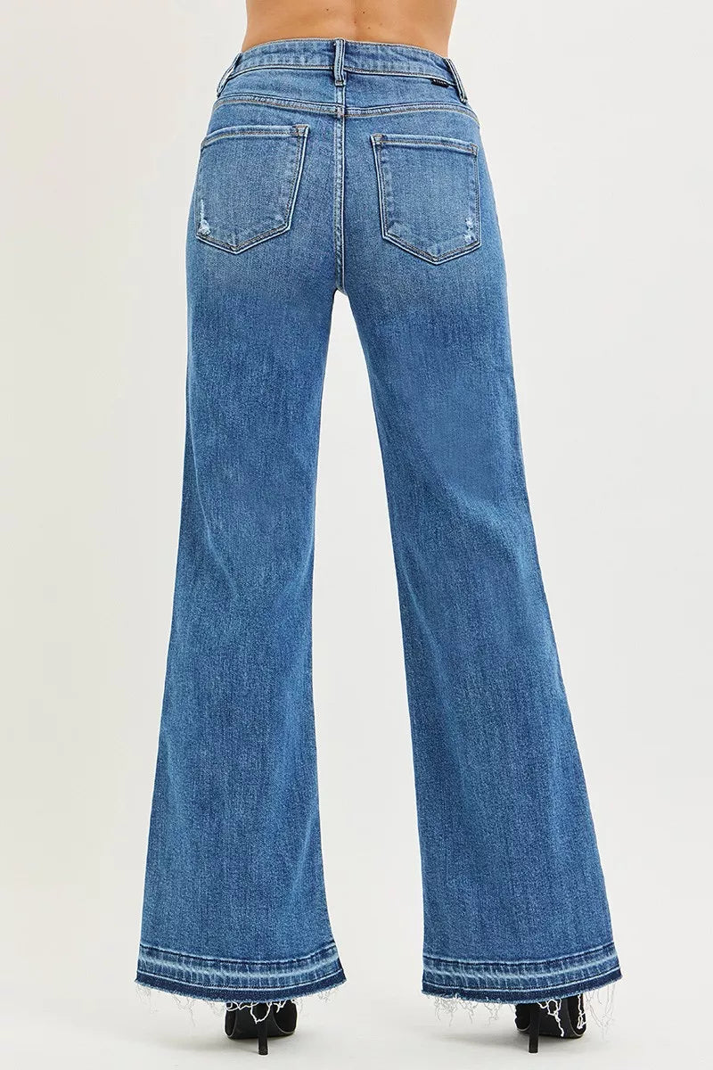 Blue flared jeans on a white background