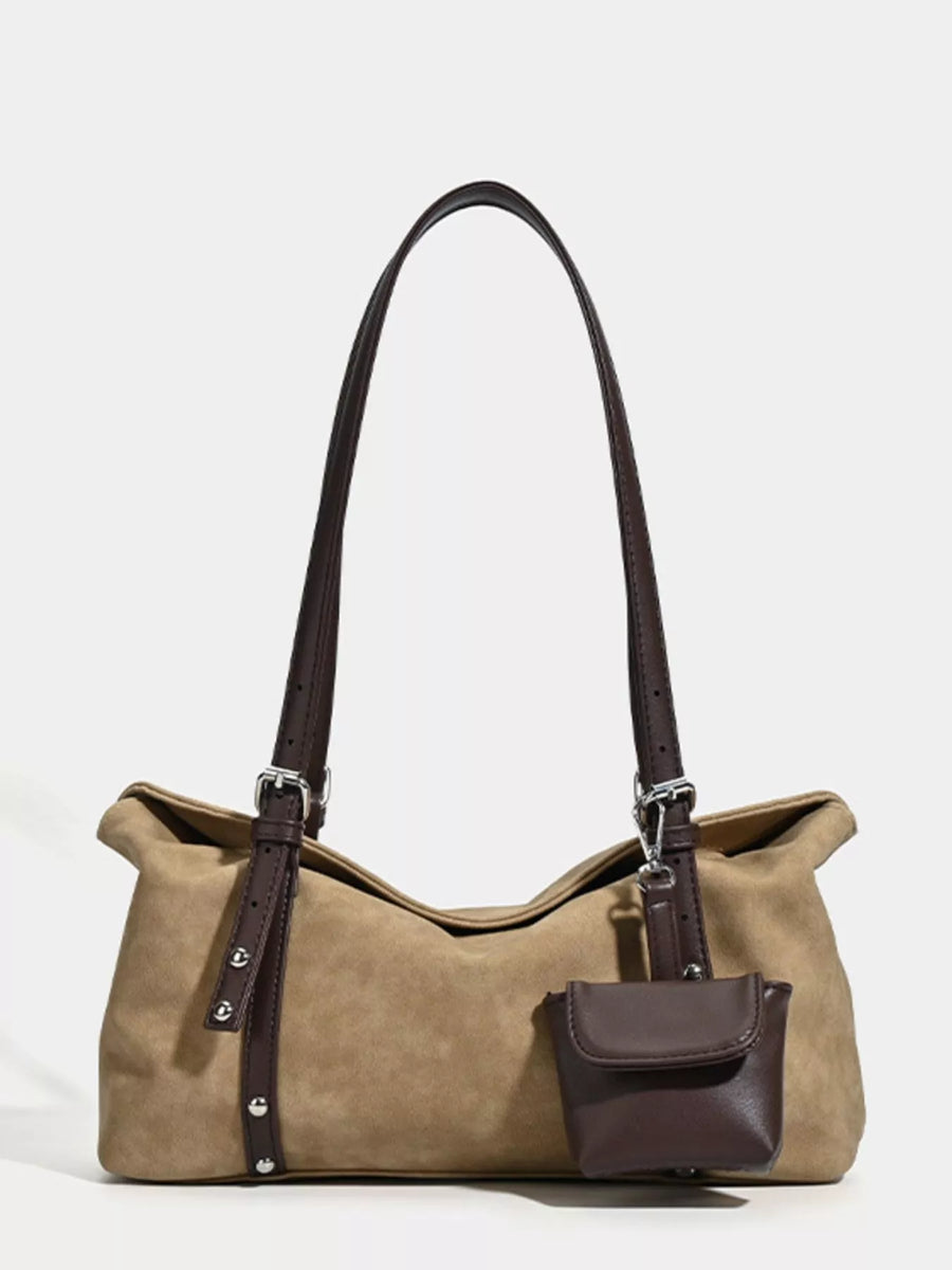 Brown handbag with a matching pouch on a white background