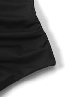 Close-up of a black fabric texture on a white background