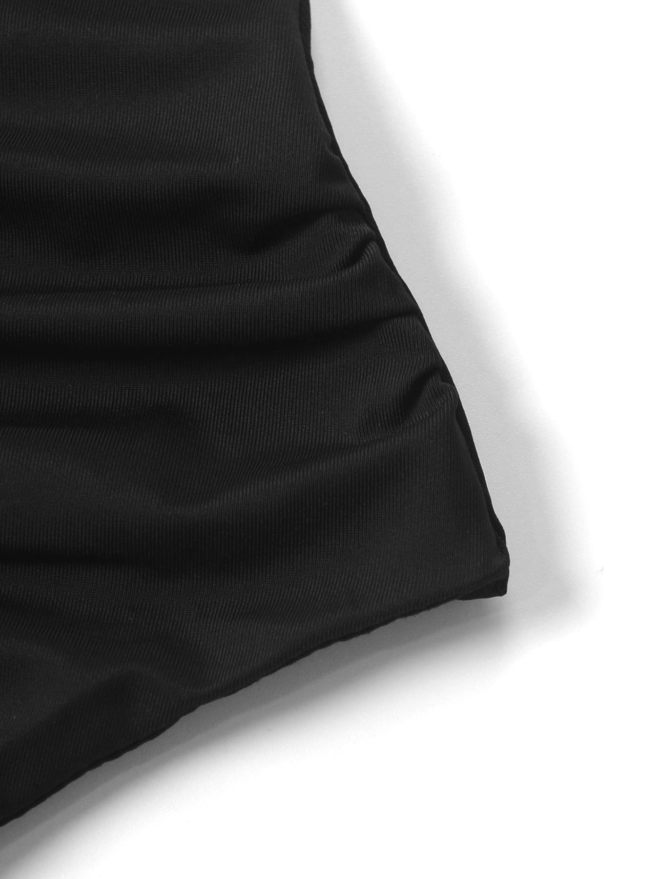 Close-up of a black fabric texture on a white background