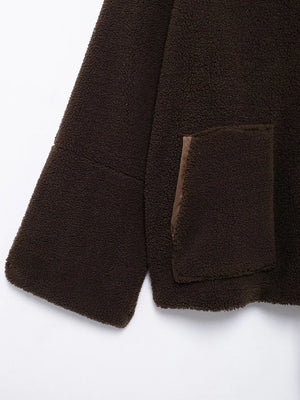 Close-up of a brown textured fabric with a pocket on a white background