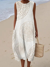 Woman wearing a white crochet dress on a beach