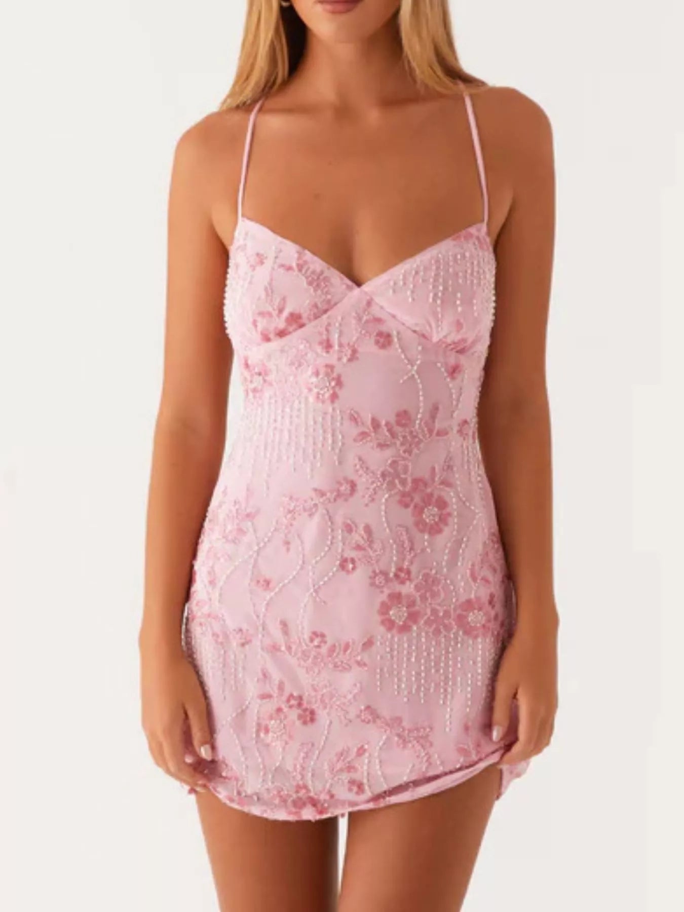 Pink lace nightgown worn by a model on a white background