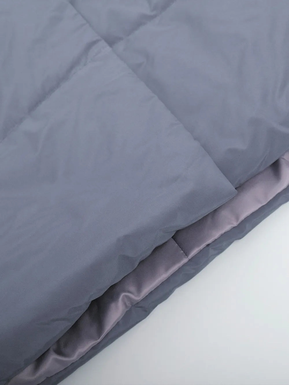 Gray comforter on a white background