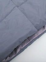 Gray comforter on a white background