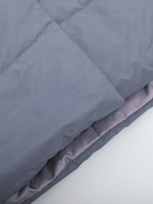 Gray comforter on a white background