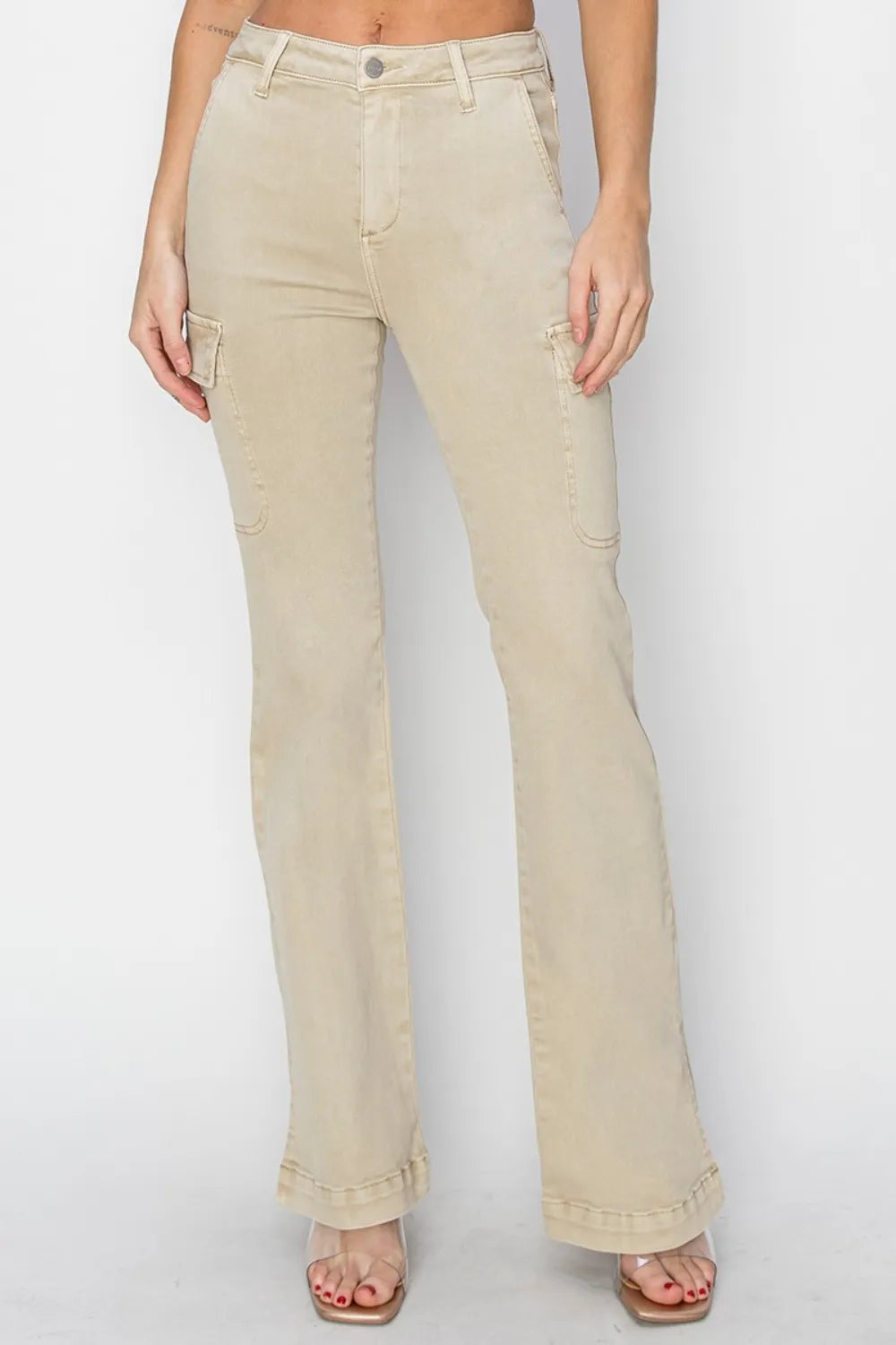 Beige jeans worn by a person on a white background