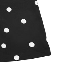 Black fabric with white polka dots on a white background