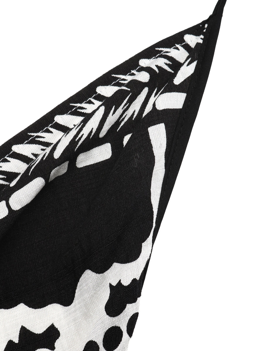 Black and white patterned fabric with abstract shapes on a white background